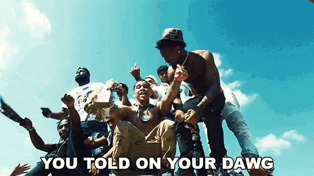 a group of men are gathered together with the words " you told on your dawg "