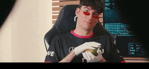 a man wearing sunglasses and a black shirt with the word we on it