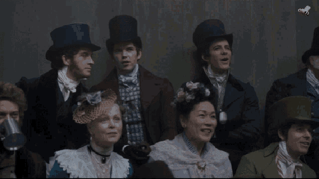 a group of people wearing top hats and costumes with a yellow bee flying in the background