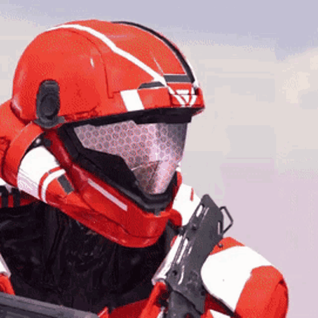 a close up of a red helmet with a white stripe on it