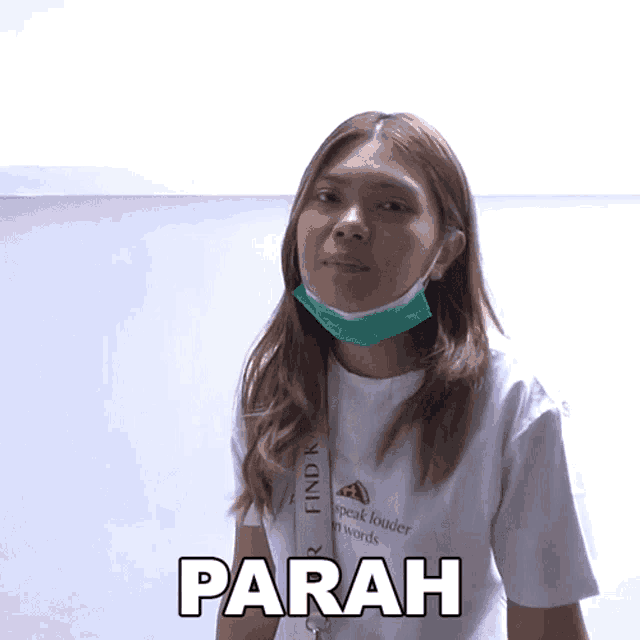 a woman wearing a mask and a white shirt with the word parah on it