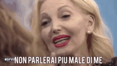 a close up of a woman 's face with the words non parlerai piu male di me written below her