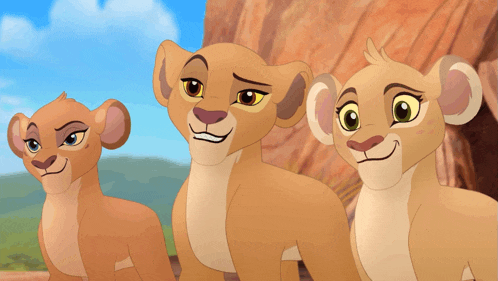 three lion cubs are standing next to each other
