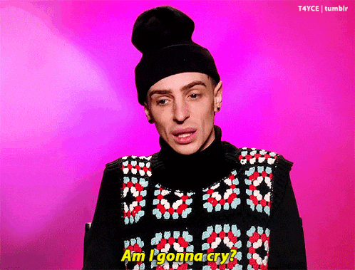 a man wearing a hat and a sweater says am i gonna cry