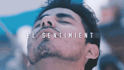 a close up of a man 's face with the words el sentimiento written above it