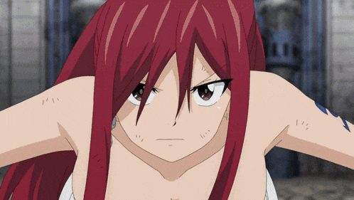 a close up of a girl with red hair