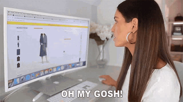 a woman is sitting in front of a computer with the words oh my gosh on the screen