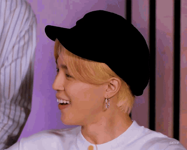 a close up of a person wearing a hat
