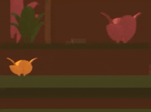 a cartoon character is dancing in a video game while a cat watches .