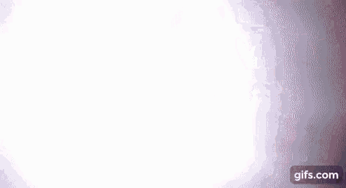 a white light is shining through a dark background .