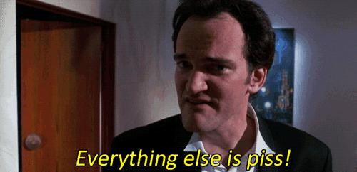 a man in a suit says " everything else is piss " in front of a door