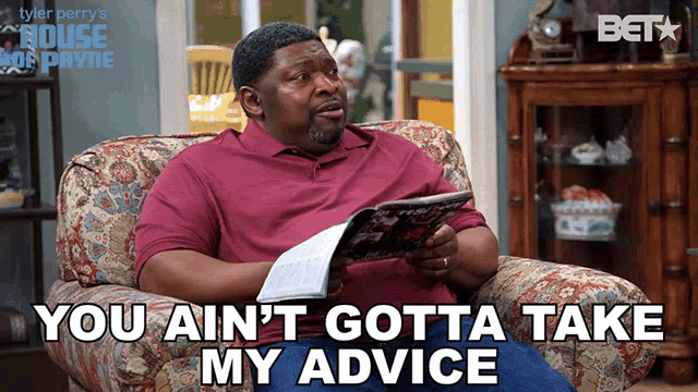 a man sitting on a couch reading a magazine with the words you ain t gotta take my advice