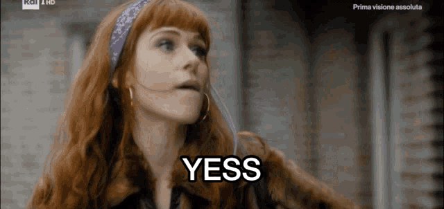 a woman with red hair says yess in a tv show