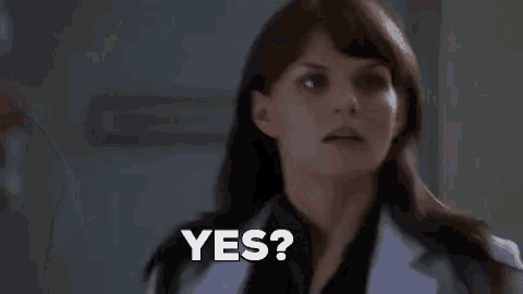 a woman in a lab coat is asking a question and says yes .
