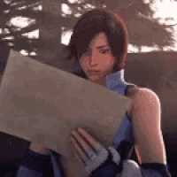 a woman is holding a piece of paper and looking at it