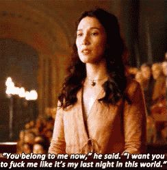a woman is standing in front of a crowd and says you belong to me now