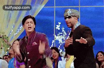 a group of men are dancing together in a room .
