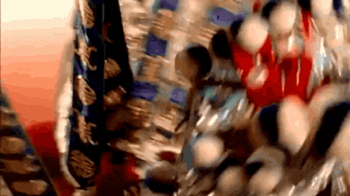 a close up of a painting with a lot of balls on it