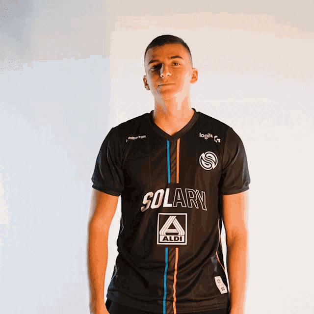 a man is wearing a black shirt that says solarn