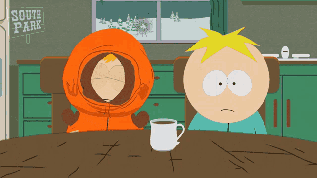 two south park characters are sitting at a table