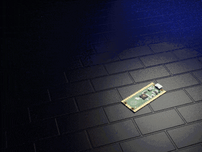 a small electronic device is laying on a black tile floor