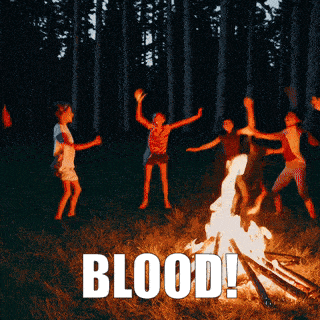 a group of children are dancing around a campfire with the words blood written below them