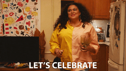 a woman in a yellow and pink shirt is holding a glass of wine and the words let 's celebrate are above her