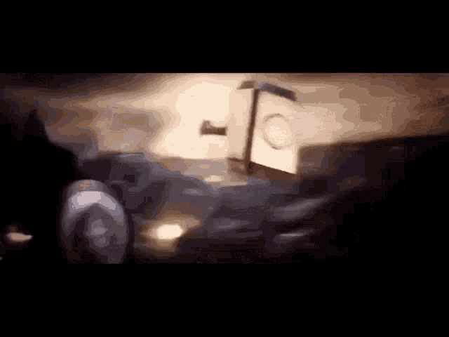 a blurry picture of a table with a hammer and a circle on it