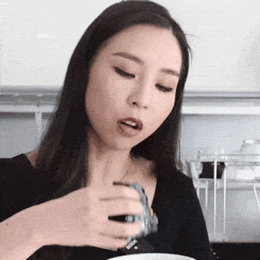 Taking A Bite Tina Yong GIF - Taking A Bite Tina Yong Eating GIFs