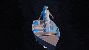 a close up of a woman with blue hair