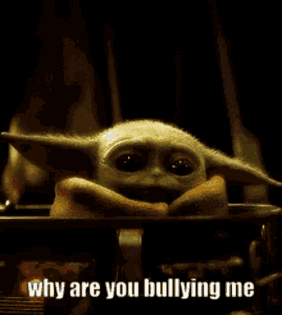 a baby yoda is sitting in a dark room and says why are you bullying me