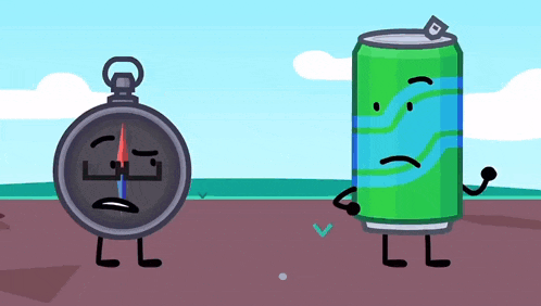 a compass and a can are standing next to each other in a field
