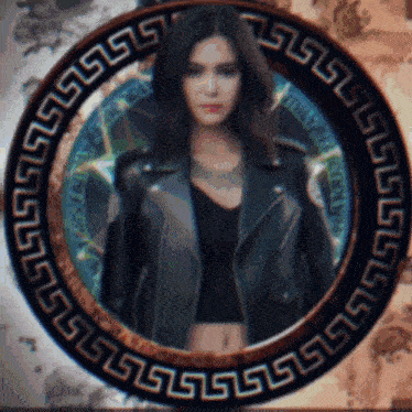 a woman in a leather jacket is surrounded by a greek key design