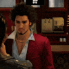 a man in a red jacket is standing next to a woman in a restaurant .