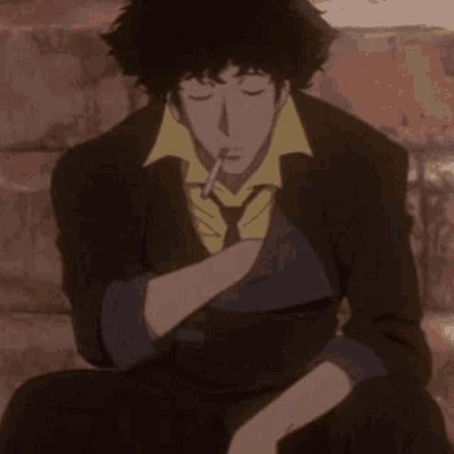 a man in a suit is drinking through a straw .