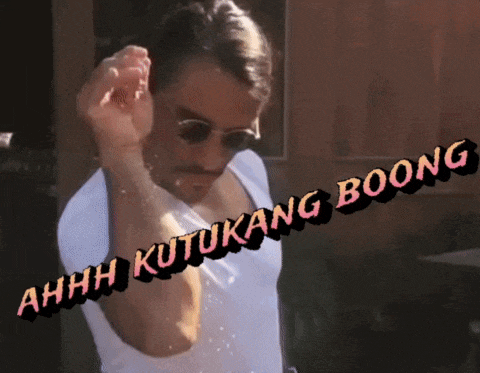a man wearing sunglasses and a white shirt with the words ahhh kutukang boong on the bottom