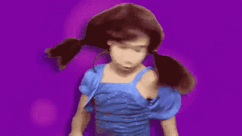 a girl in a blue dress is dancing on a purple background .