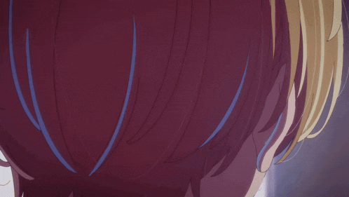 a close up of a person 's hair and ear with blue lines