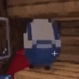a blue and white backpack is sitting on top of a wooden table in a room .