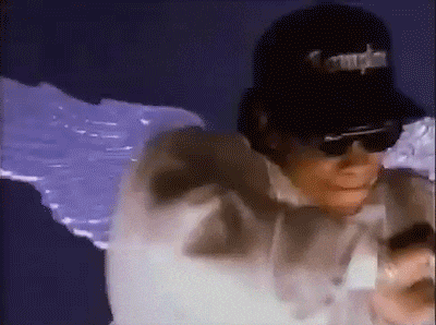 a man wearing sunglasses and a hat that says compton