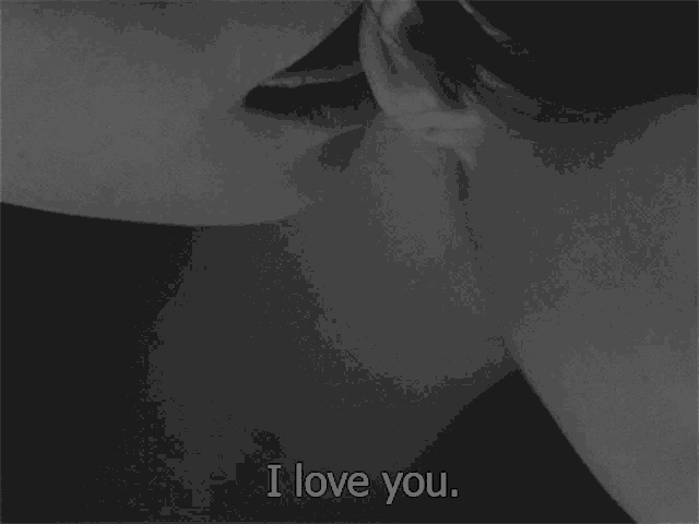 a black and white photo of a couple kissing with the words i love you