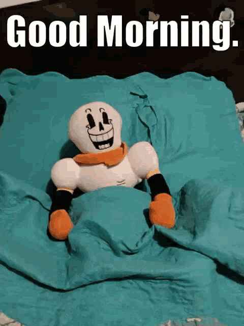 a stuffed skeleton is laying on a bed with the words " good morning " on the bottom