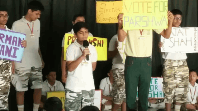 a group of people holding signs that say vote for parshwa and jat shah