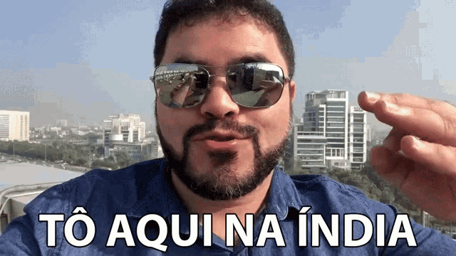 a man wearing sunglasses says to aqui na india in a foreign language