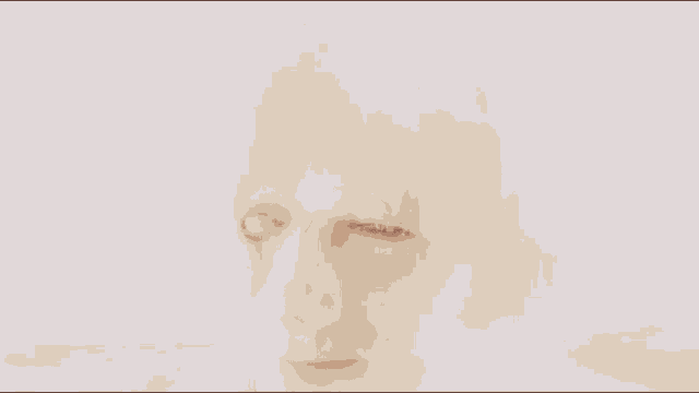 a close up of a person 's face with a white hair and a broken eye .
