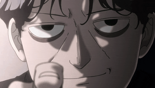 a close up of a person 's face with a finger pointing at the camera