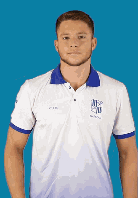 a man wearing a polo shirt with atleta on the front