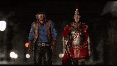 a man dressed as a cowboy and a man dressed as a roman soldier stand next to each other