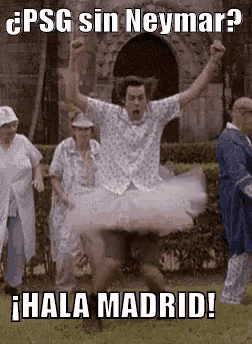a man in a tutu is jumping in the air while a group of people watch .
