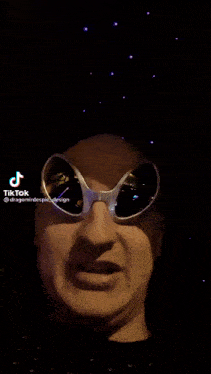 a person wearing a pair of sunglasses with a tiktok watermark on the bottom right